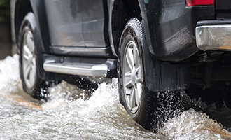 car splashing in puddle